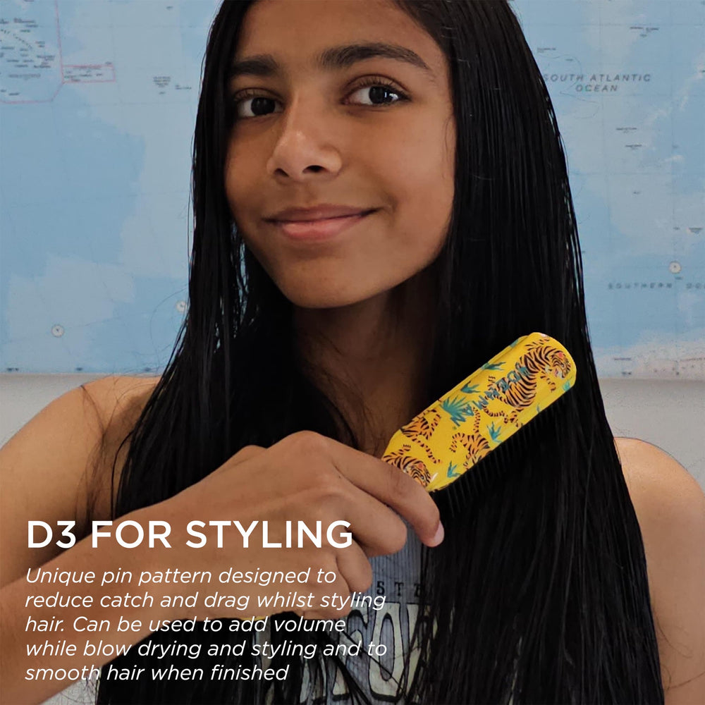 Denman D3 ergonomic handle shown during styling for comfortable use.
