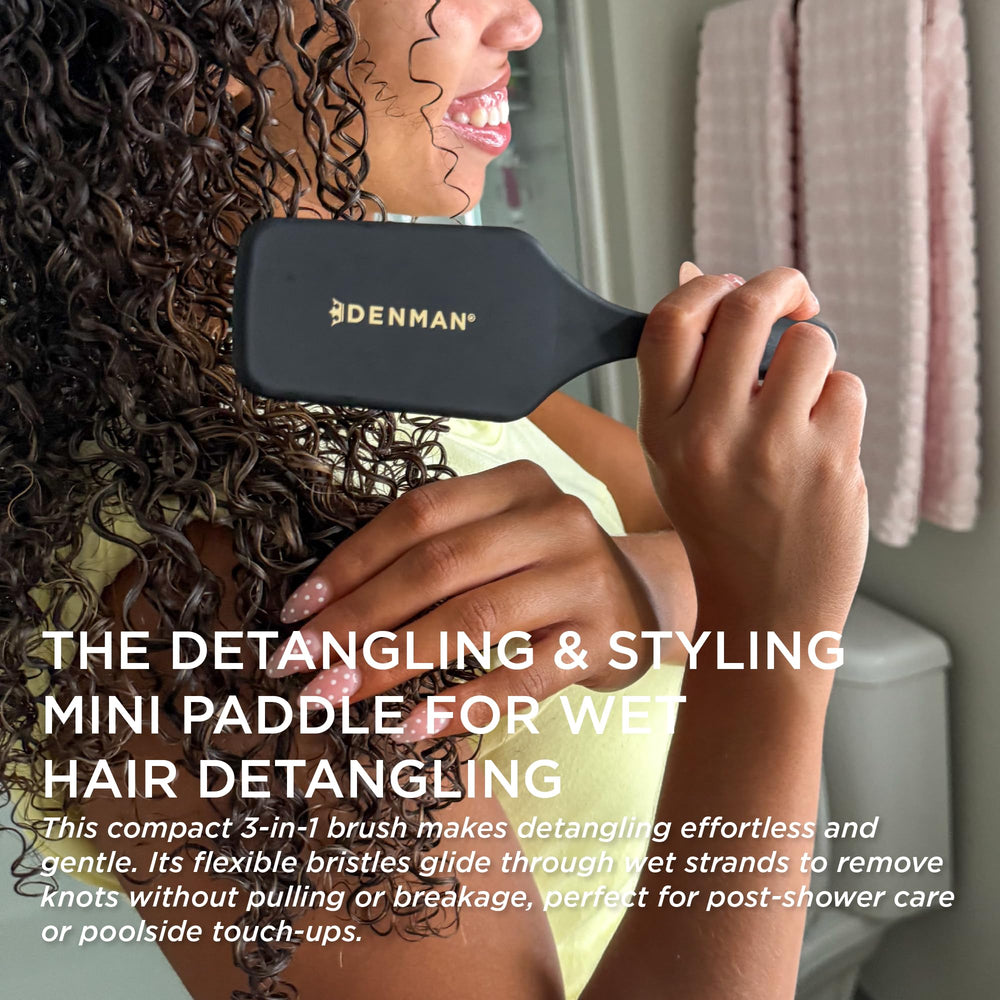 Denman D38 paddle brush head curve closeup emphasizes cushioned grip for comfort.