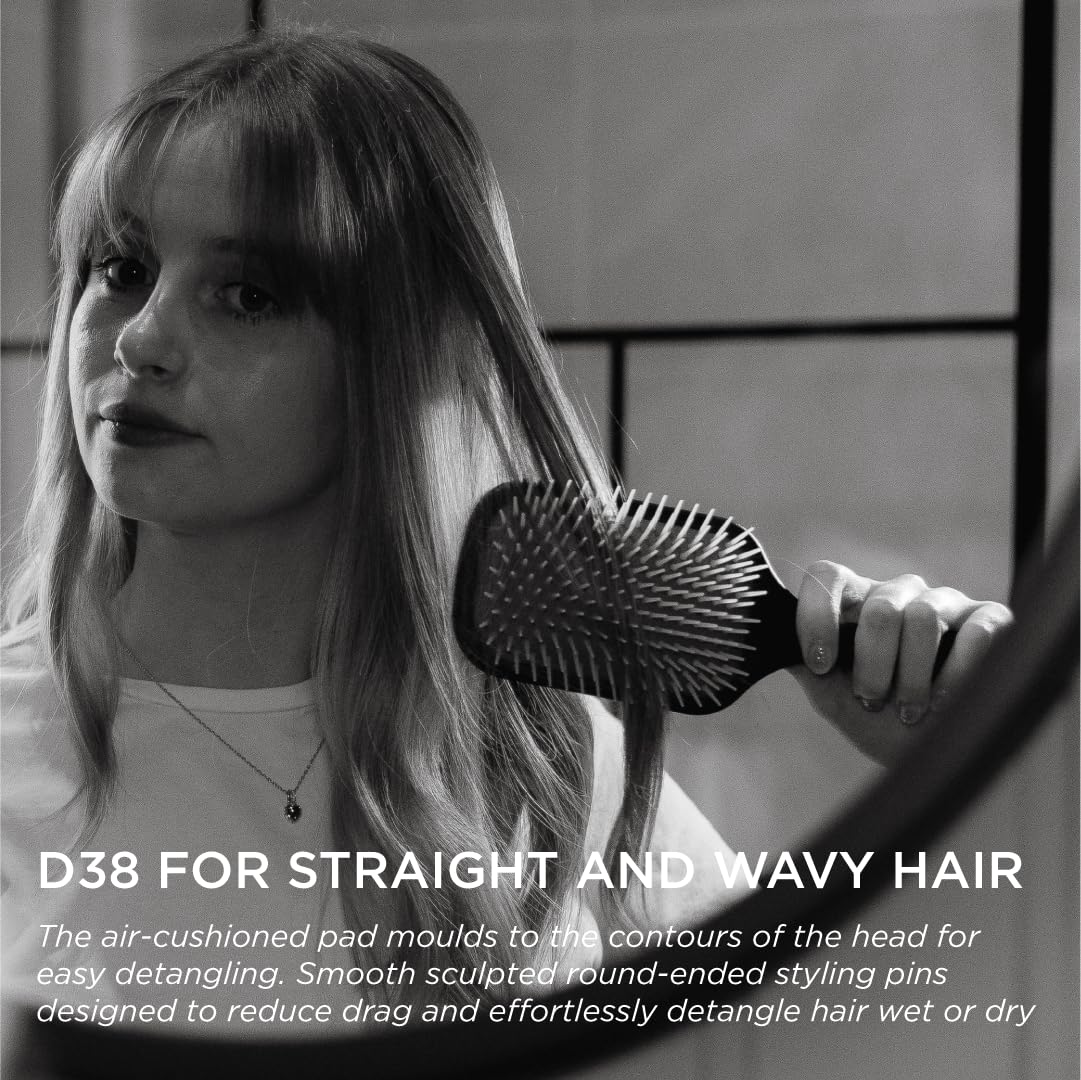 Denman paddle brush gentle grip styling enables controlled, precise shaping.