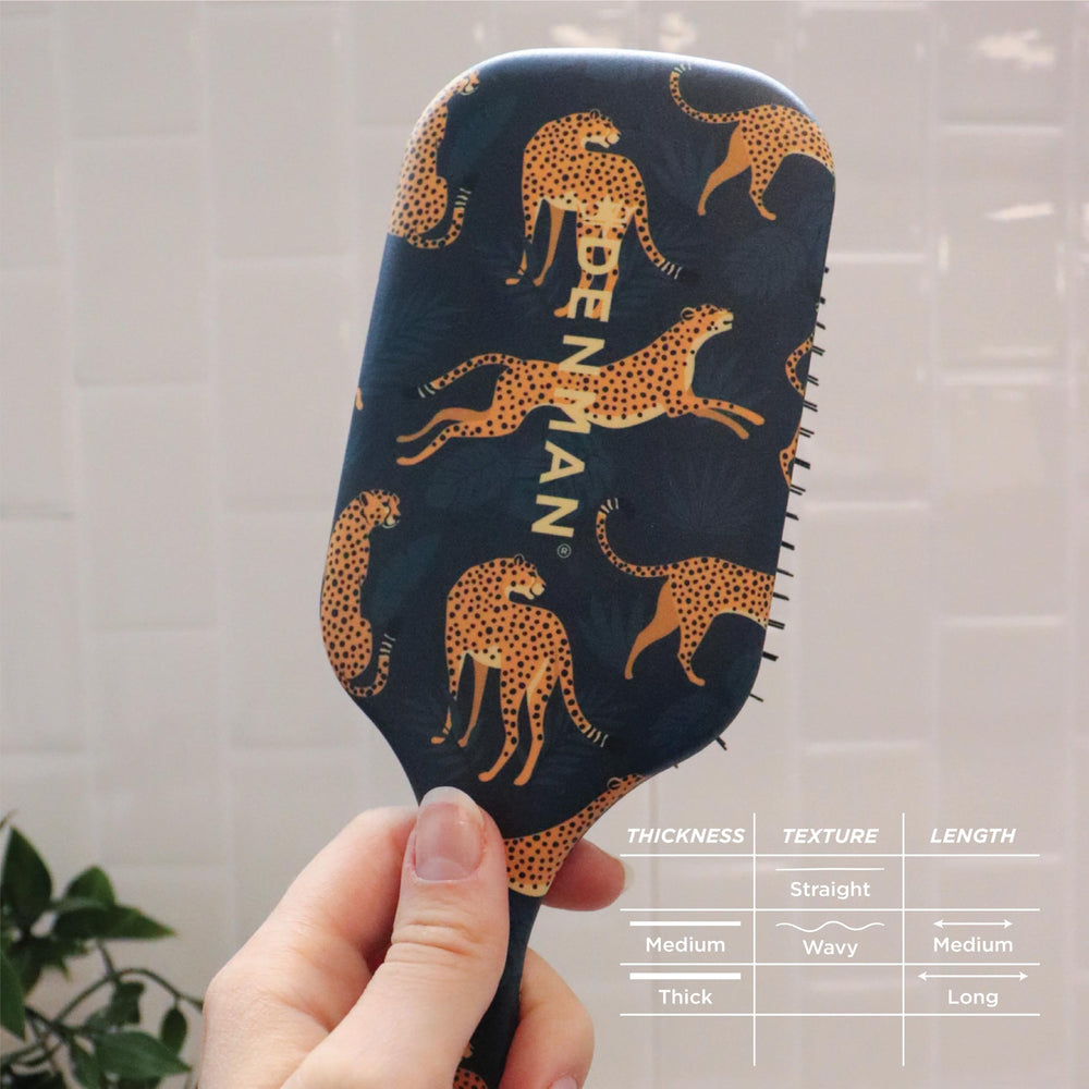 Denman Ultimate Detangling Brush during a grooming session delivering salon-quality results