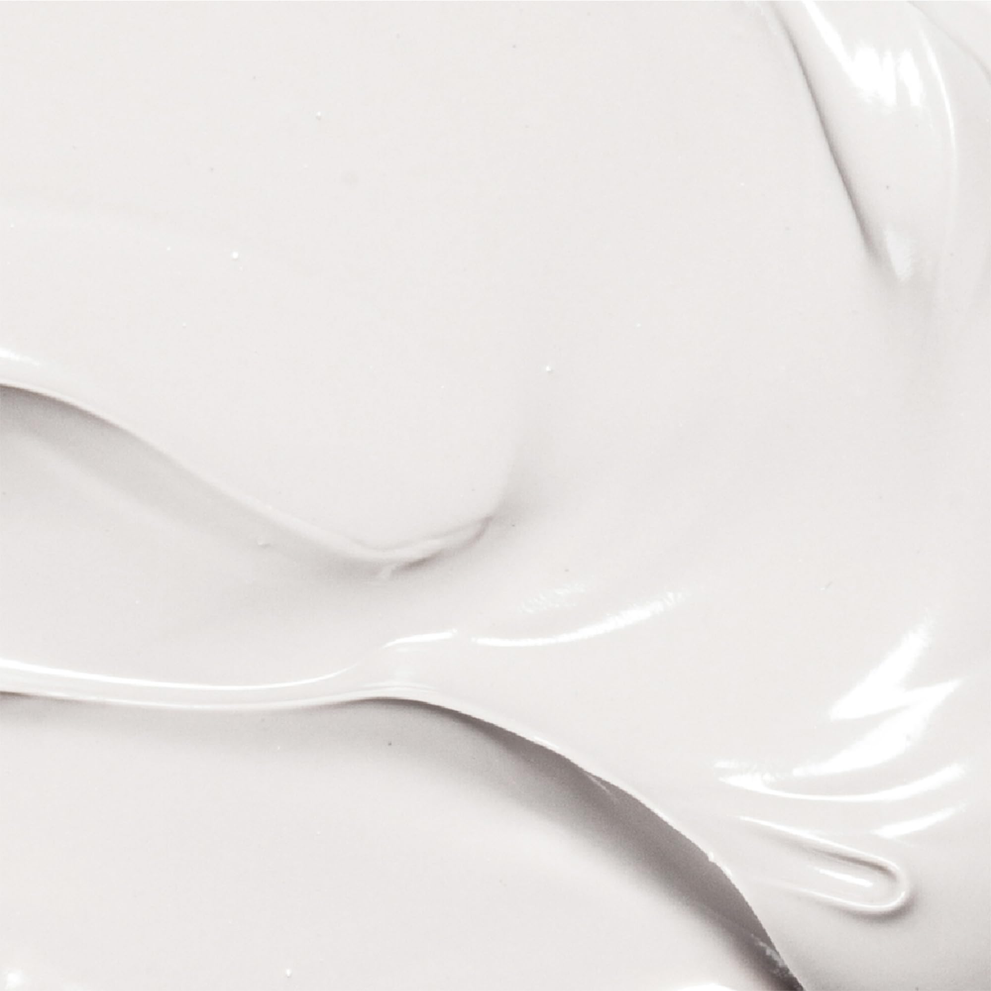 Person applying Derma E cream to dry skin areas