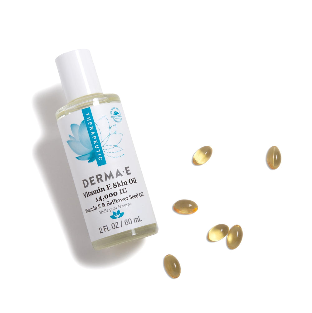 Derma E Vitamin E Skin Oil applied on the cheek delivers nourishing moisture.