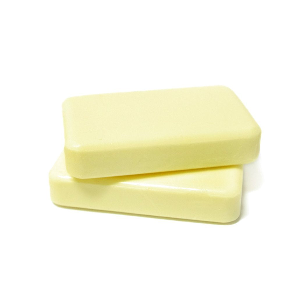 DermaHarmony bar in hand creating a rich lather for cleansing.