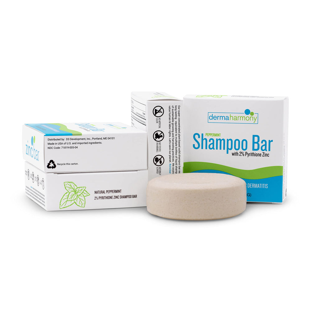 DermaHarmony shampoo bar in use shows rich lather during washing.
