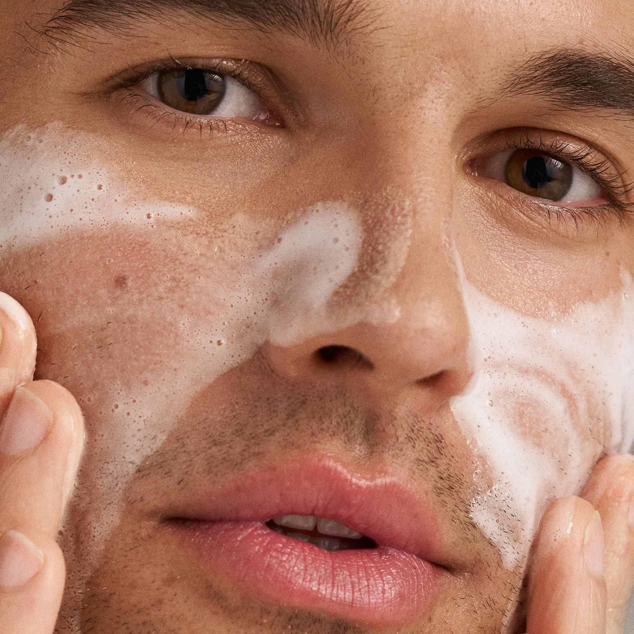 Dermalogica Daily Microfoliant powder texture shown on palm for gentle exfoliation.