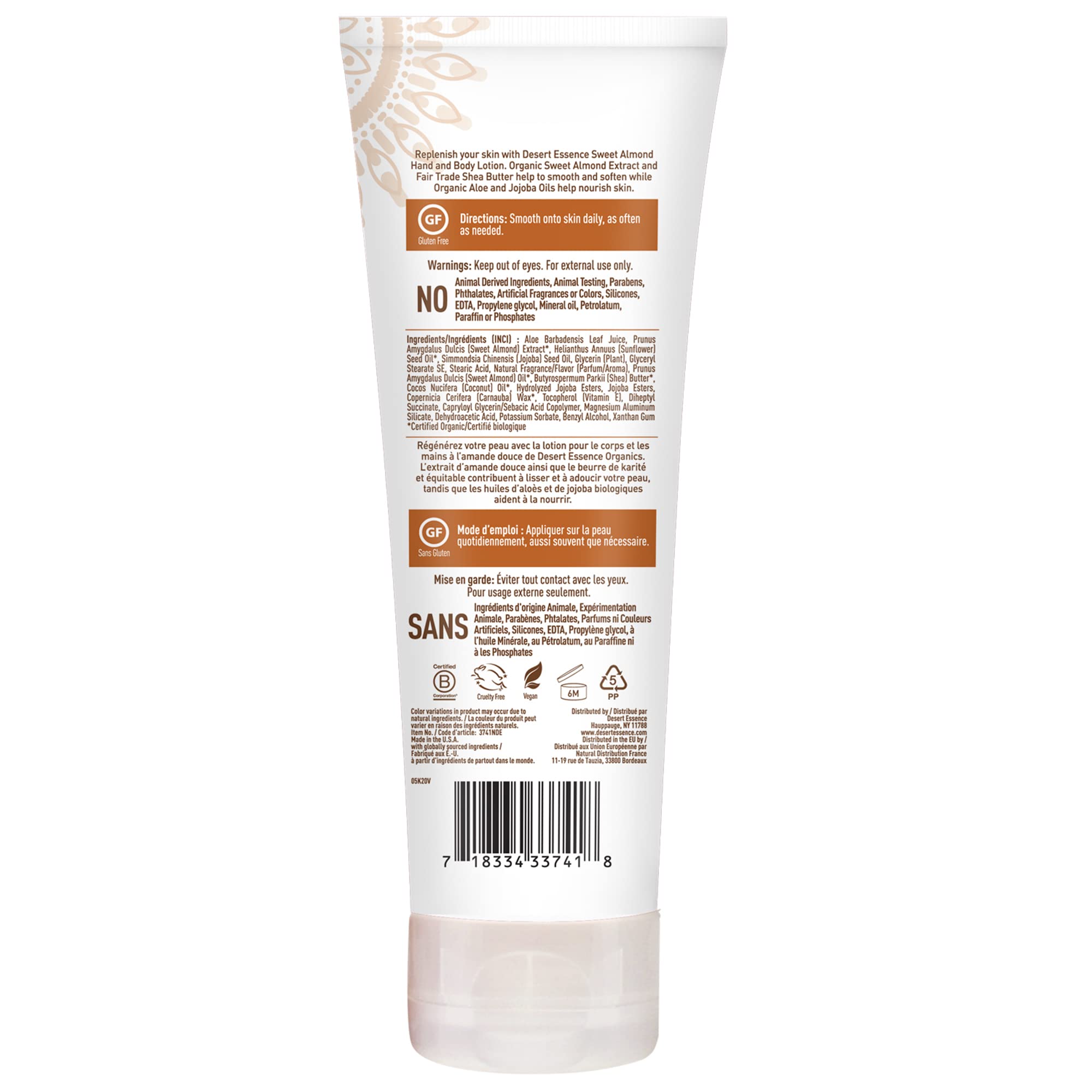 Desert Essence Sweet Almond lotion 8oz bottle cradled in hand for travel-friendly moisture.