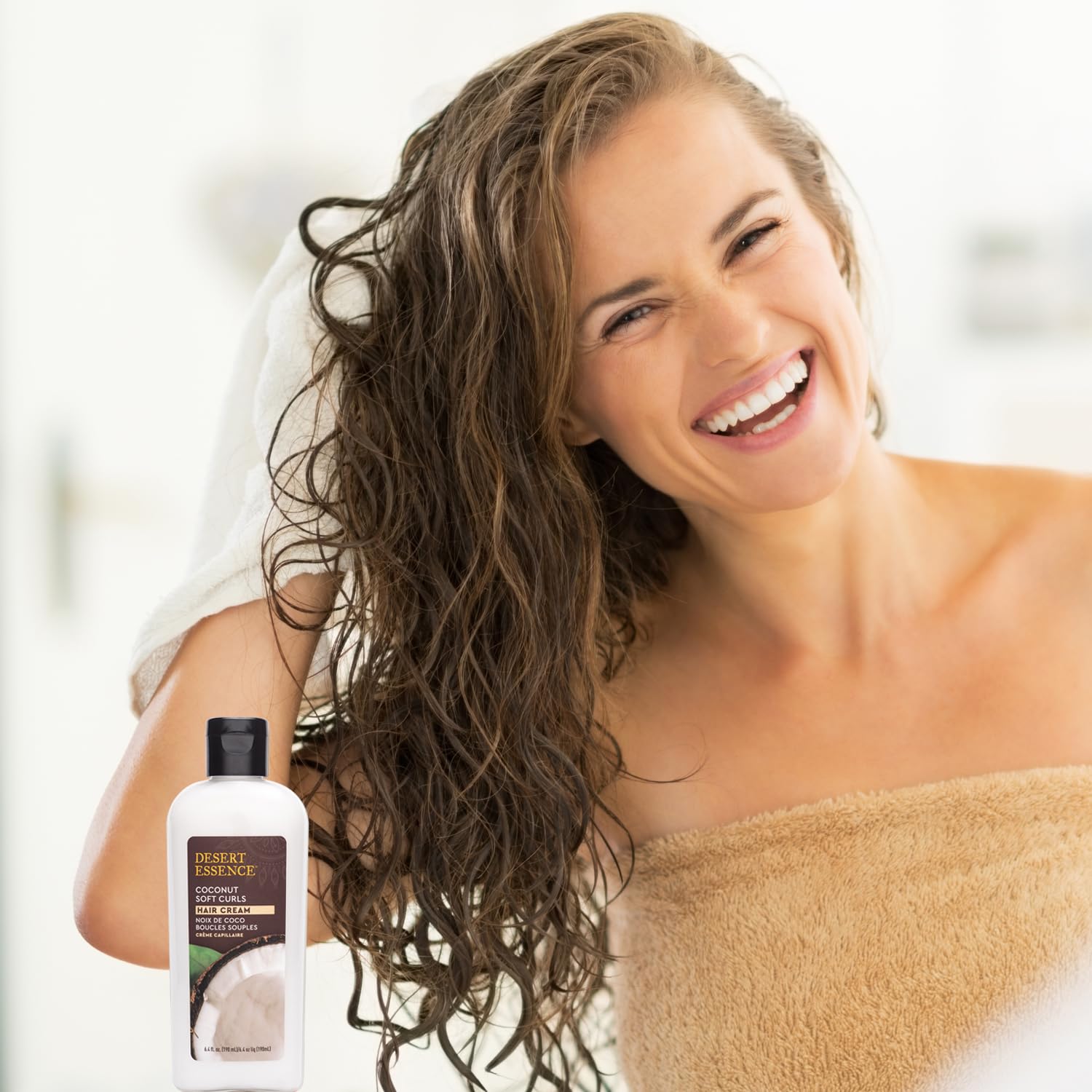 Desert Essence Coconut Soft Curls Cream texture closeup showing creamy consistency for frizz control.