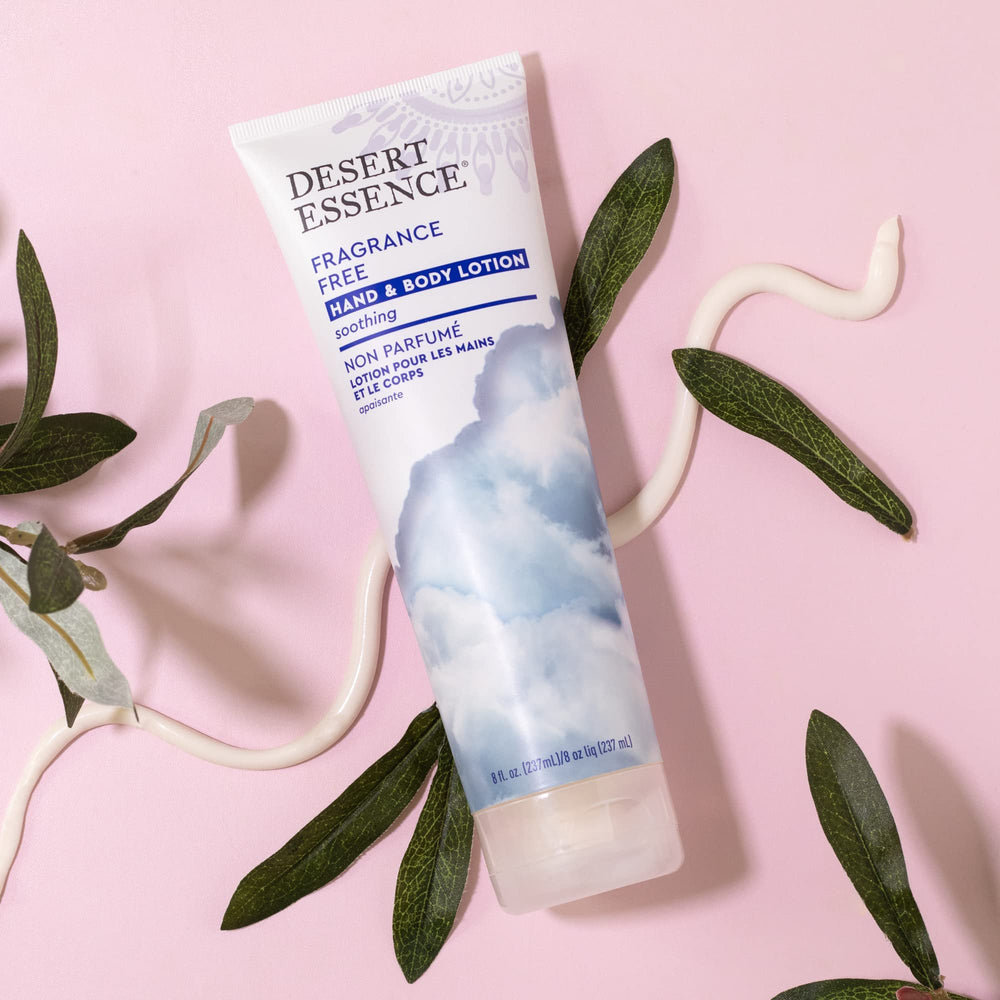 Desert Essence fragrance-free hand & body lotion closeup highlights creamy texture for smooth, non-greasy skin