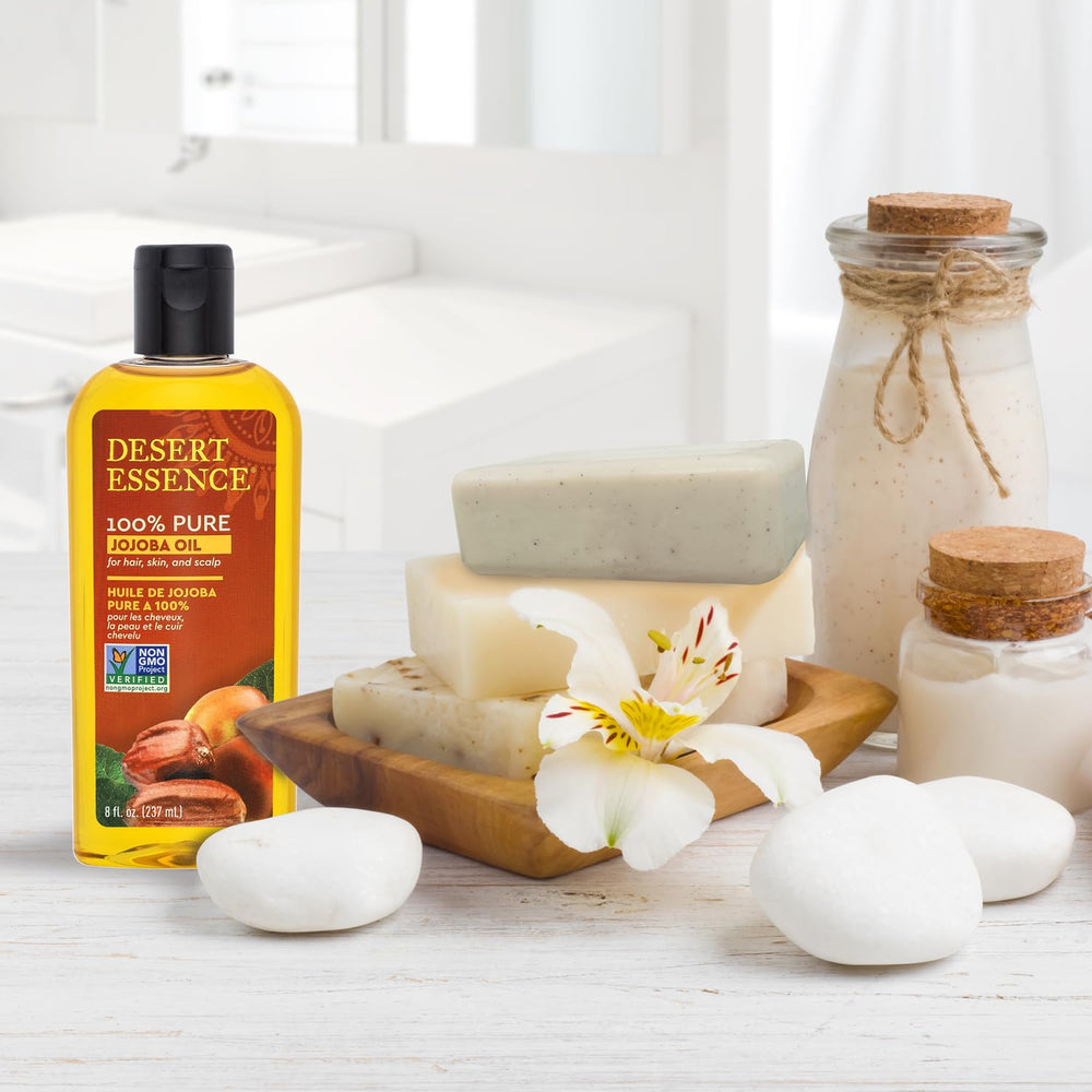 Desert Essence Jojoba Oil scalp-treatment—soothes dry scalp and supports hair health.