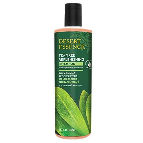 Desert Essence Tea Tree Oil Replenishing Shampoo label close-up highlights gentle-care ingredients