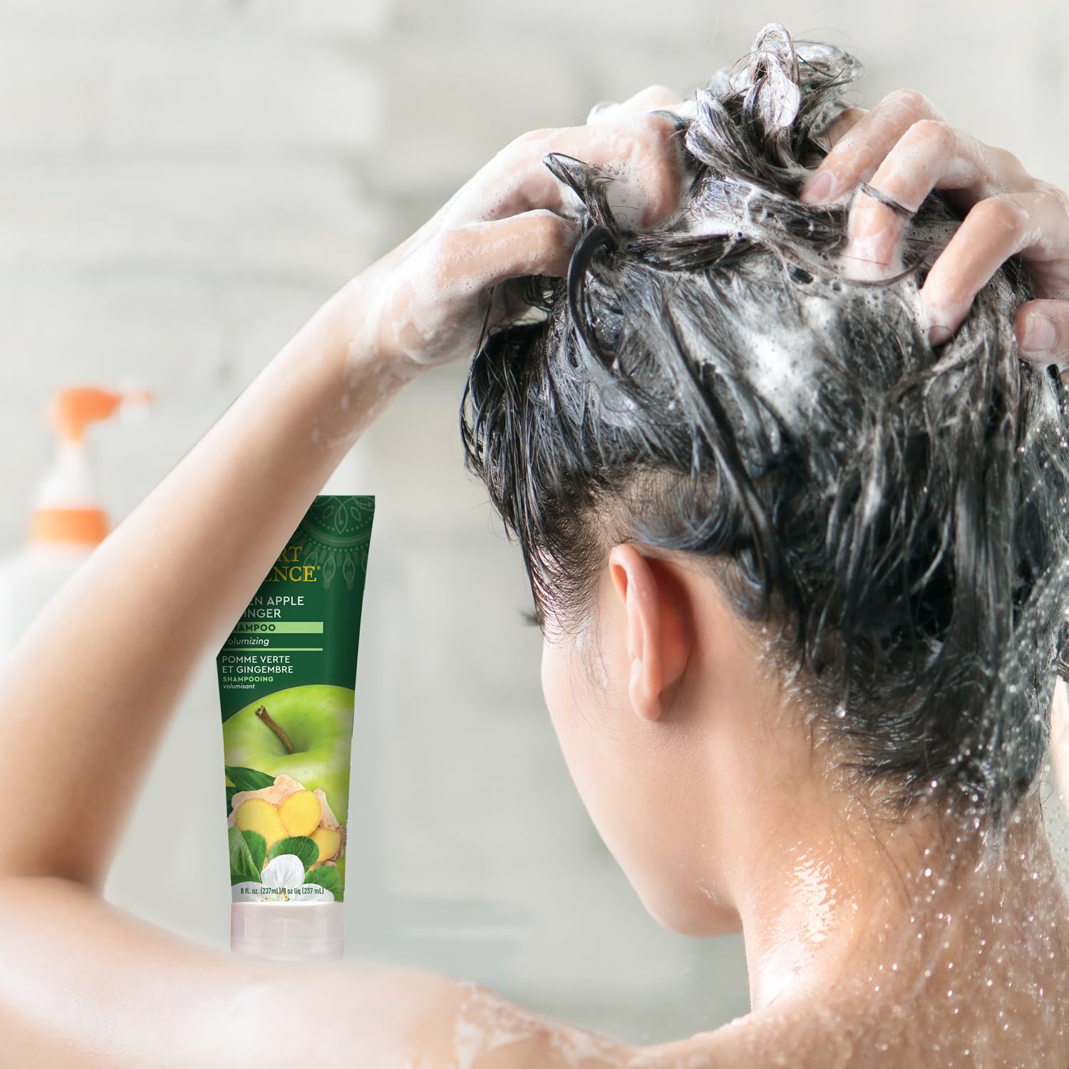 Desert Essence thickening shampoo lather close-up showcases rich foam for gentle cleansing and hair body.