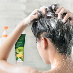 Desert Essence thickening shampoo lather close-up showcases rich foam for gentle cleansing and hair body.