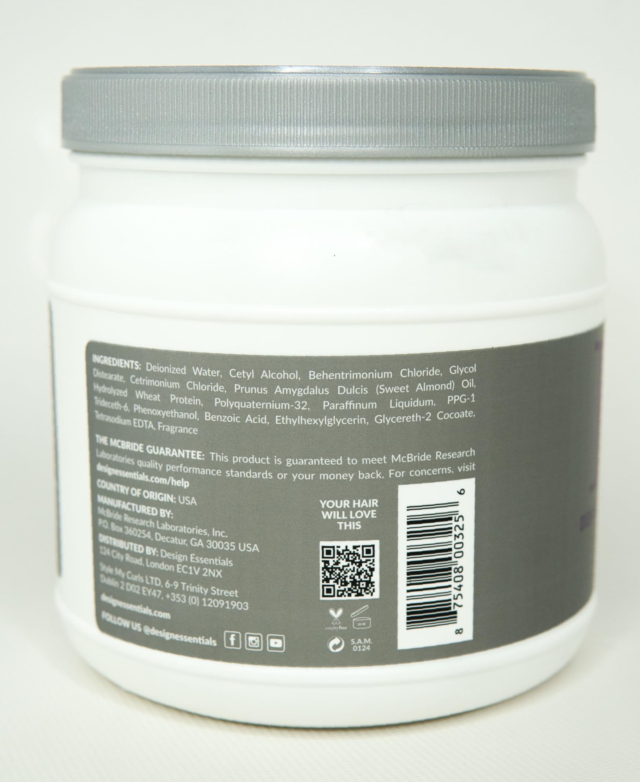 Design Essentials Almond Butter Express bottle dispensing smooth conditioner for even application.