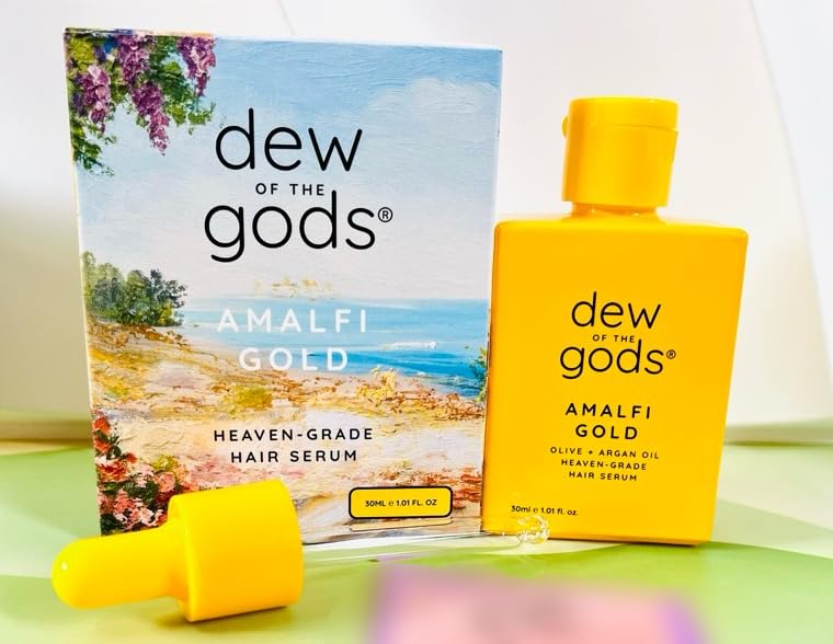 Dew Of The Gods Amalfi Gold Hair Serum bottle promoting frizz control and nourishment.