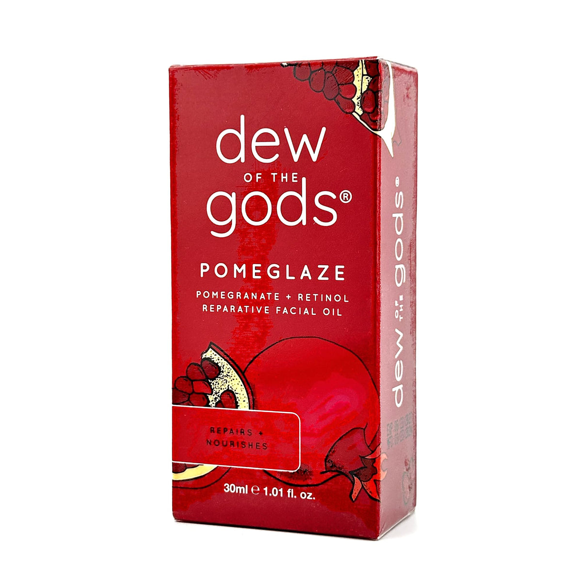 Dew Of The Gods Pomeglaze oil bottle closeup for radiant nightly repair.