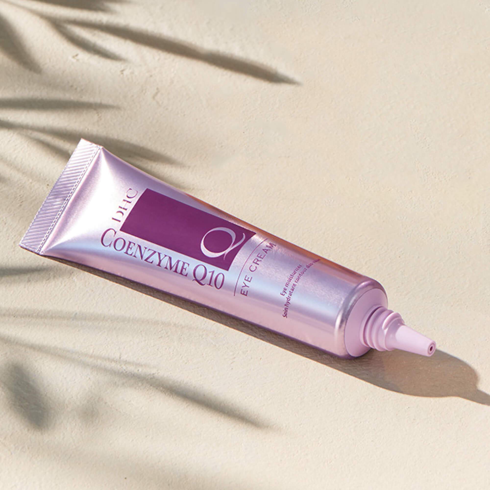 DHC CoQ10 Eye Cream application closeup shows gentle orbital bone tapping technique.