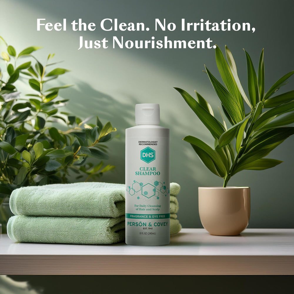 DHS Clear Shampoo 8oz bottle on bathroom shelf for daily use.