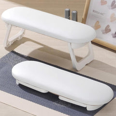 Diesisa Nail Arm Rest folded at two heights for flexible manicure positioning.