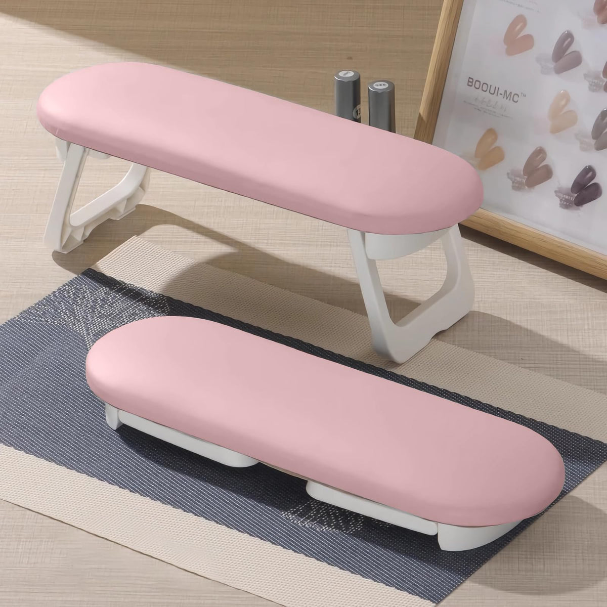 Diesisa nail arm rest folded for compact storage on a busy salon table.