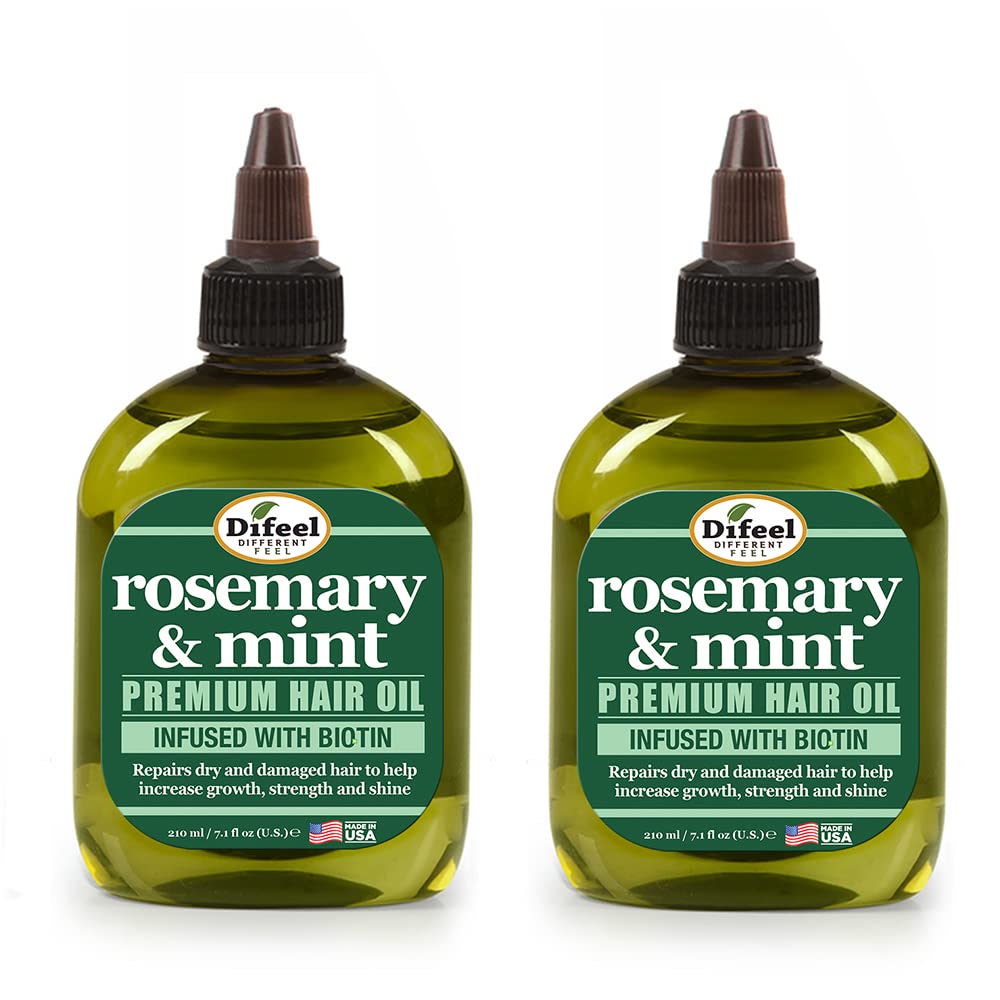 Difeel rosemary-mint hair oil bottle pour for easy scalp nourishment and shine.
