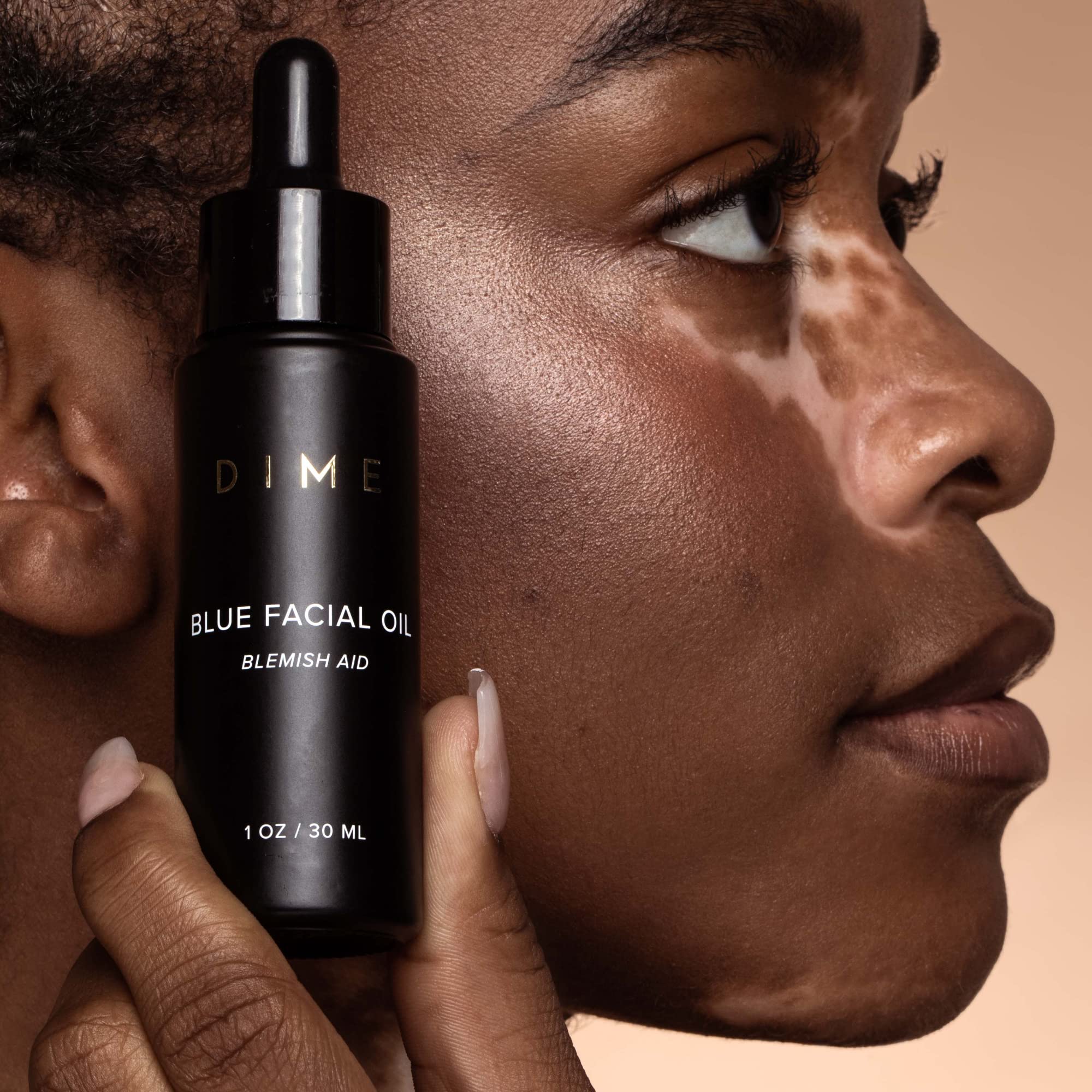 DIME Beauty Blue Facial Oil used on blemish-prone area as spot treatment