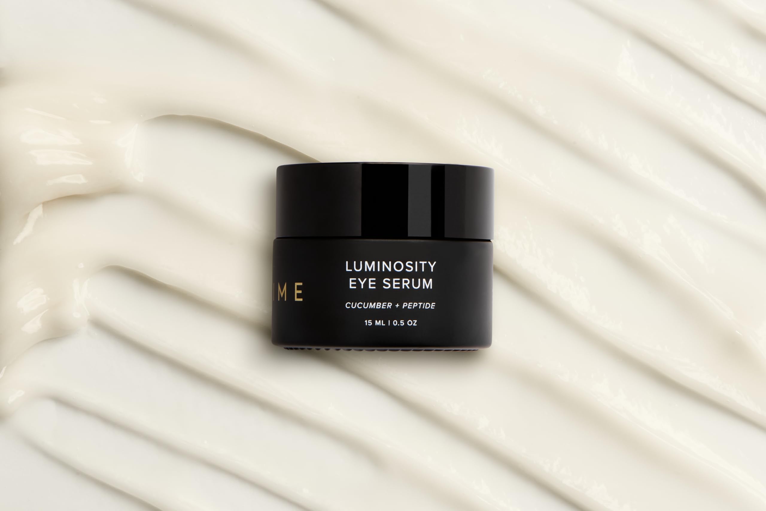 DIME Beauty Luminosity Eye Serum swirl texture emphasizing creamy formula for depuffing