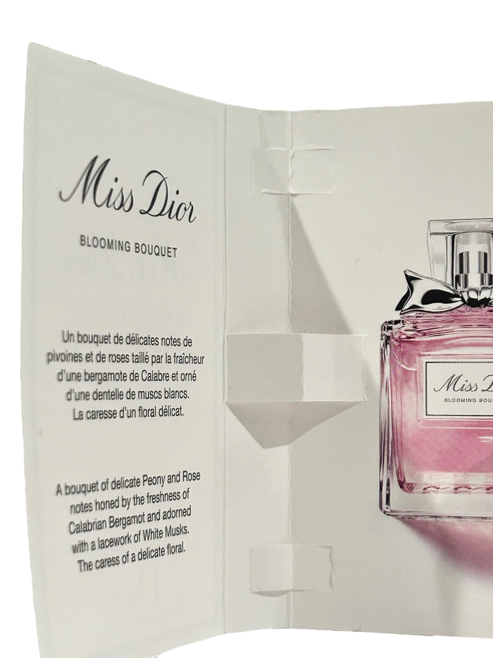 Close-up of Dior Miss Blooming Bouquet sample vial for travel touch-ups.