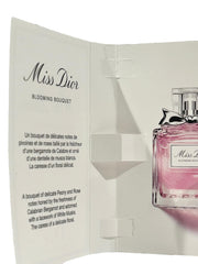 Close-up of Dior Miss Blooming Bouquet sample vial for travel touch-ups.