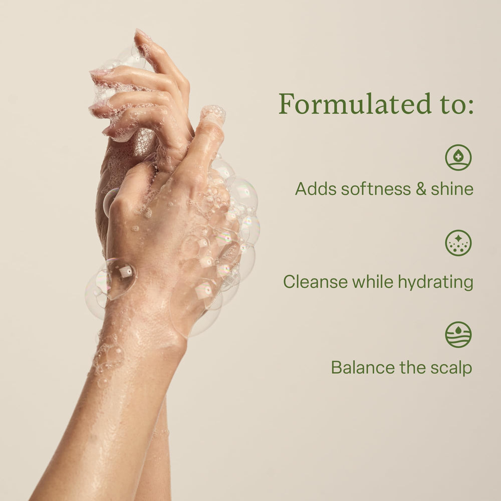 Divi Hydrating Shampoo tea tree oil droplets promoting clean, balanced scalp.
