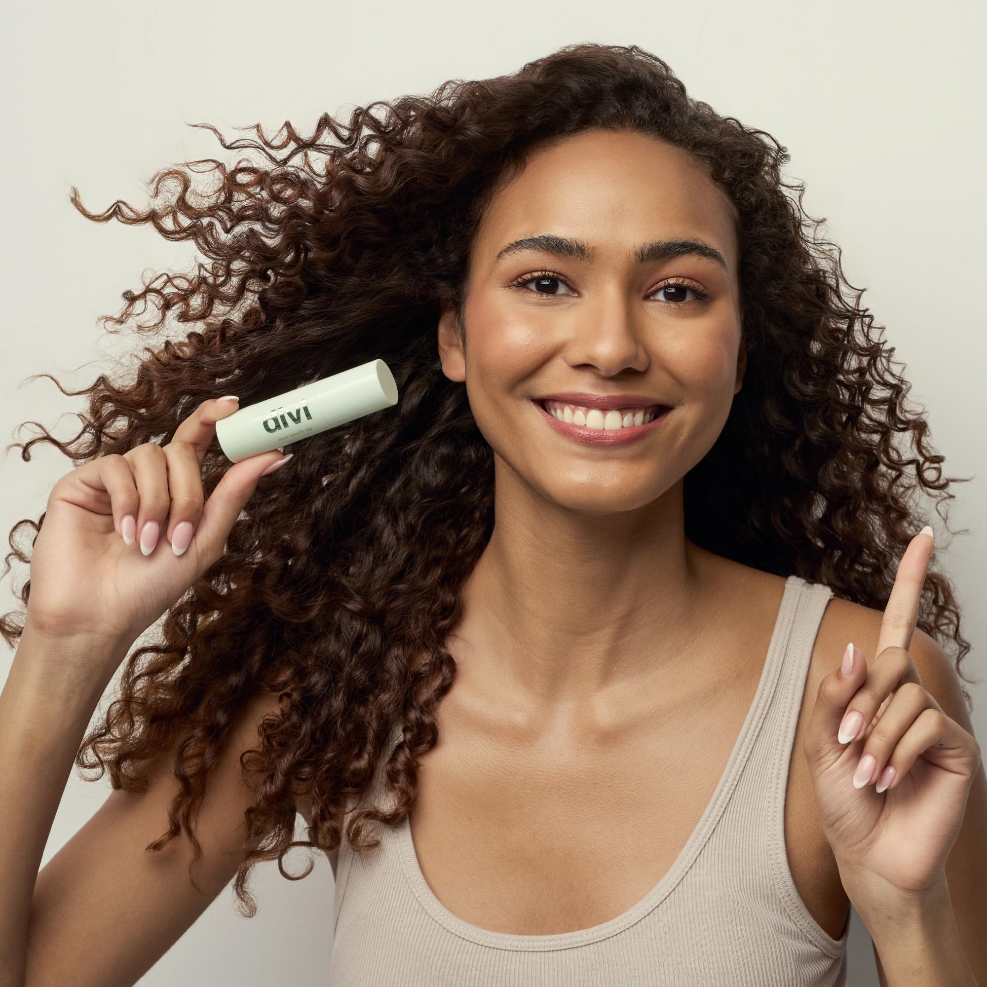 Compact packaging of Divi root touch-up powder for travel.