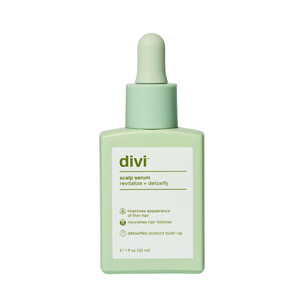 Divi Scalp Serum bottle dispensing for precise scalp application and nourishment.