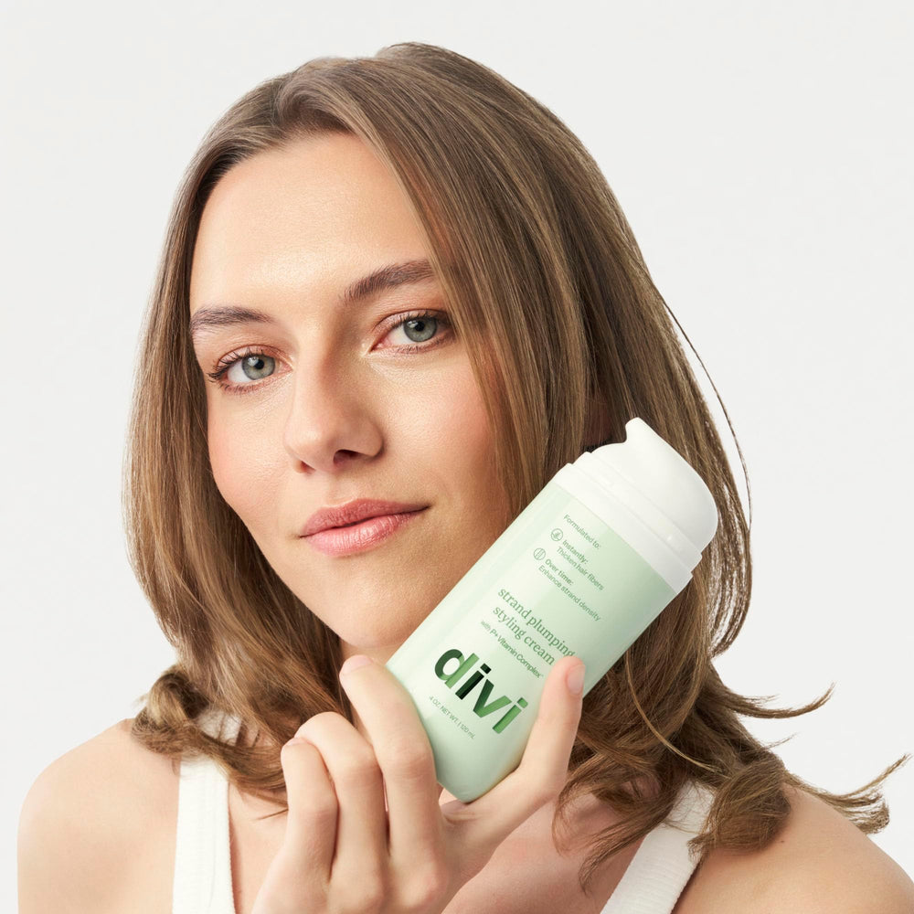 Divi Strand Styling Cream in motion on hair, showing added bounce for fine strands.