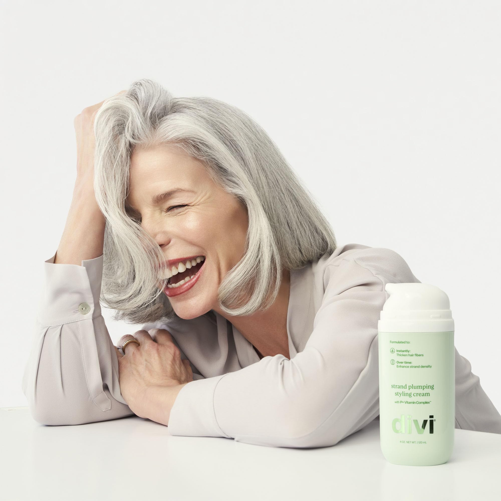 Divi Strand Styling Cream texture closeup showing creamy formula for smooth frizz control.