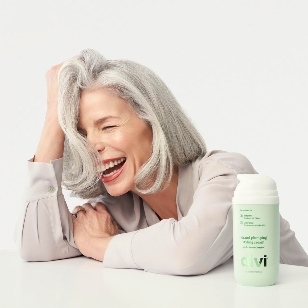 Divi Strand Styling Cream texture closeup showing creamy formula for smooth frizz control.