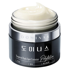 DOMINAS Dark Spot Corrector Cream jar closeup showing rich texture for even skin tone.
