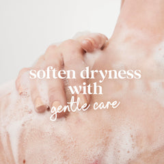 Close-up of creamy lather from Dove Sensitive Skin Body Wash for gentle cleansing.