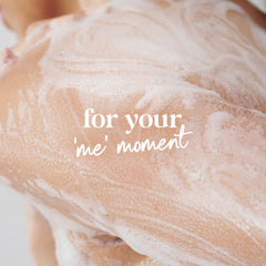 Dove Relaxing Lavender Body Wash being dispensed in a shower.