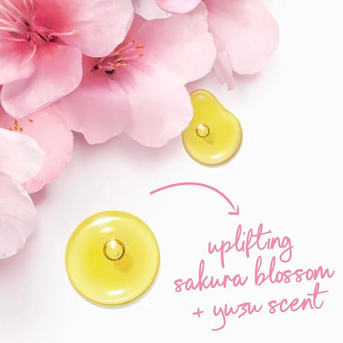 Dove Uplifting Sakura Blossom & Yuzu bottle closeup showcases vegan formula and no sulfates.