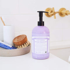 Dr. Bronner's organic shikakai powder closeup suggests natural conditioning for skin and hair.