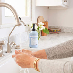 Dr. Bronner's Sugar Soap used on the face for mild cleansing and hydration.