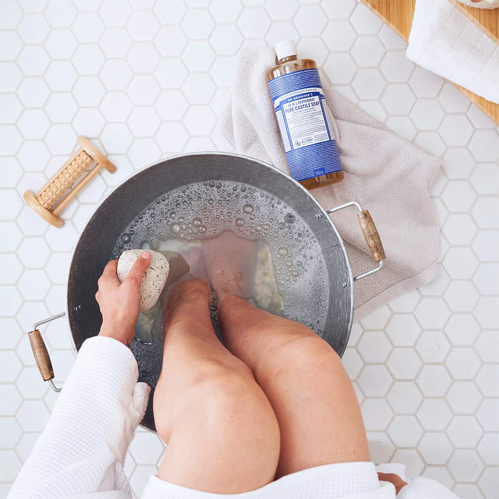 Dr. Bronner's Peppermint pet-clean close-up demonstrating safe, versatile use for pets and messes.