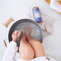 Dr. Bronner's Peppermint pet-clean close-up demonstrating safe, versatile use for pets and messes.