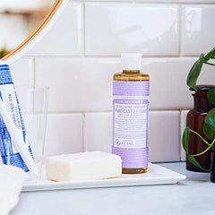 Dr. Bronner's lavender-dilution setup demonstrates multi-use for dishwashing and brush cleaning.