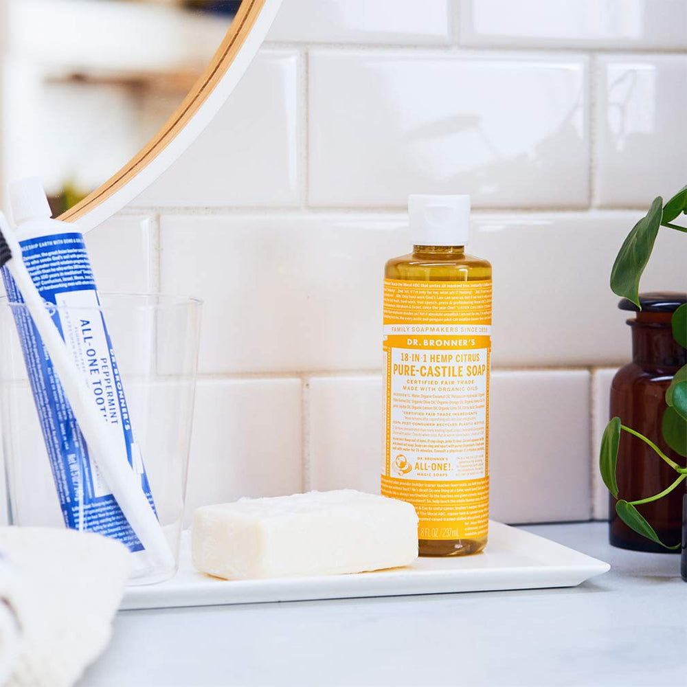 Dr. Bronner's Citrus soap in dilution-ready bottle for multiple household tasks.