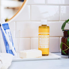 Dr. Bronner's Citrus soap in dilution-ready bottle for multiple household tasks.