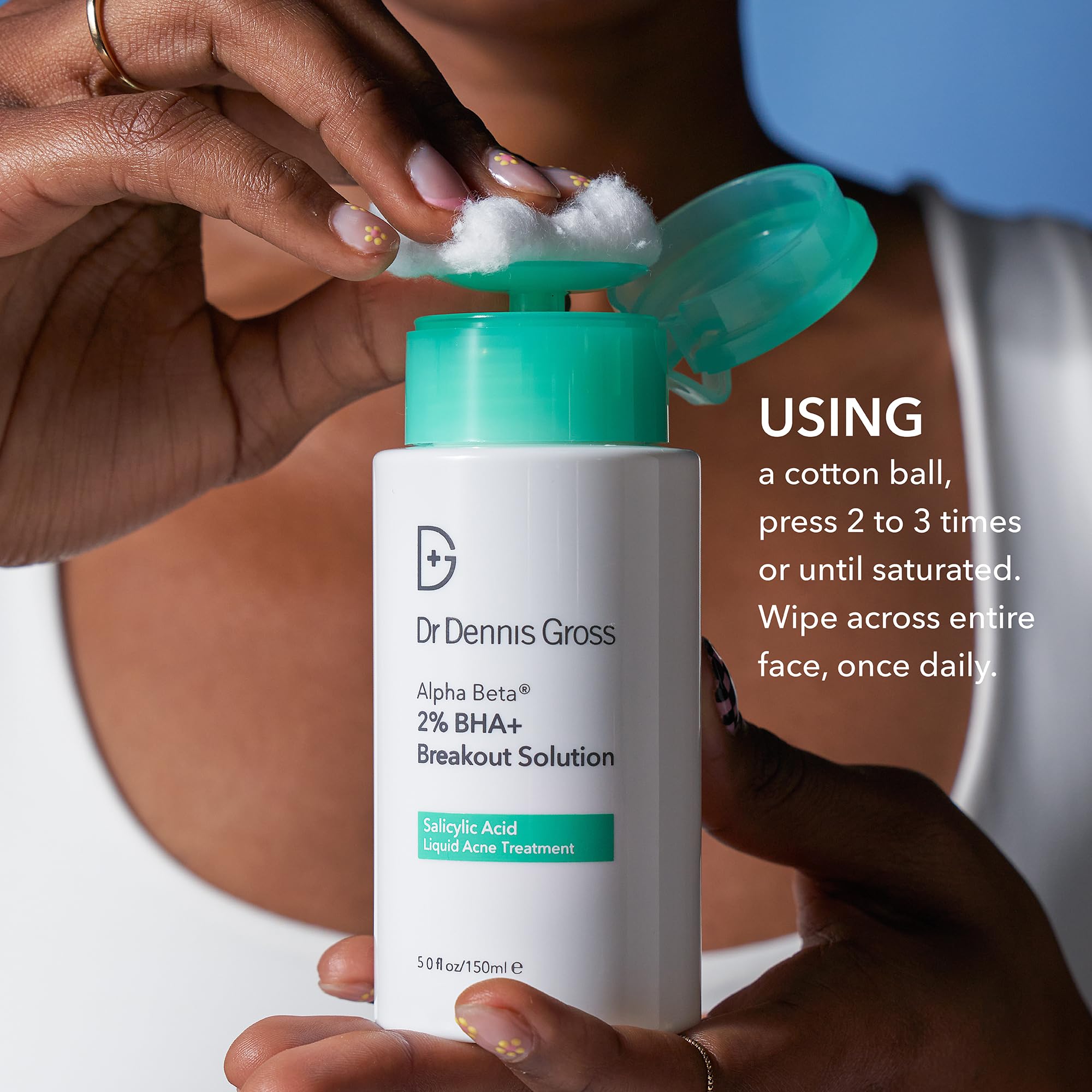 Dr Dennis Gross Alpha Beta 2% BHA+ droplet on skin hints at pore clearing benefits