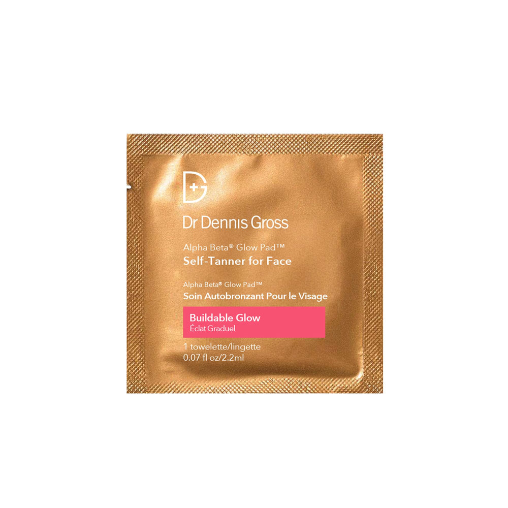 Dr Dennis Gross Glow Pad texture close-up shows exfoliating action with AHAs/BHAs.