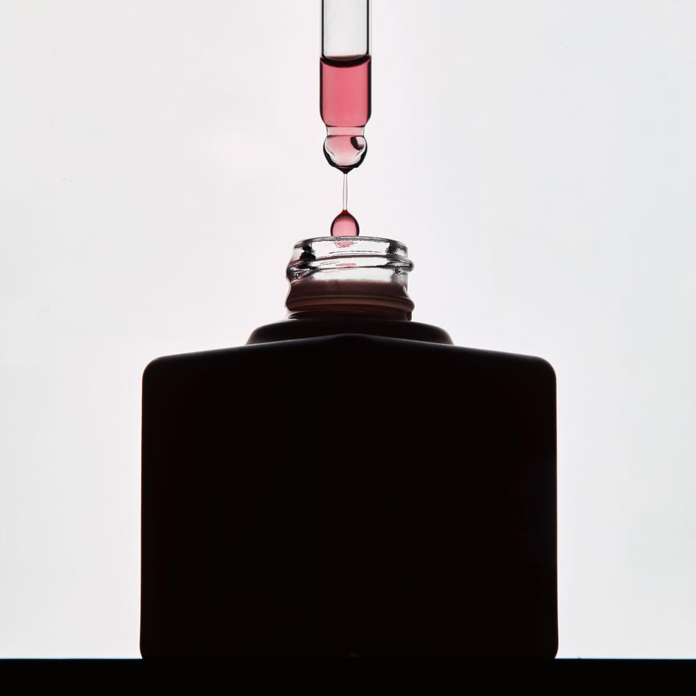 Glass bottle reflects premium skincare experience with spa-like, results-focused imagery.