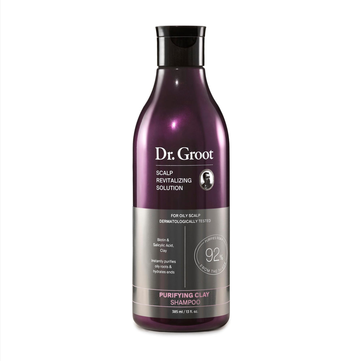 Dr. Groot Purifying Clay Shampoo bottle pours for scalp refreshment and oil control.
