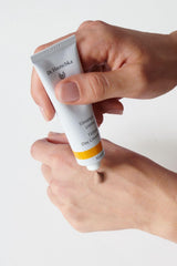 Dr Hauschka tinted day cream being applied for a subtle glow on face